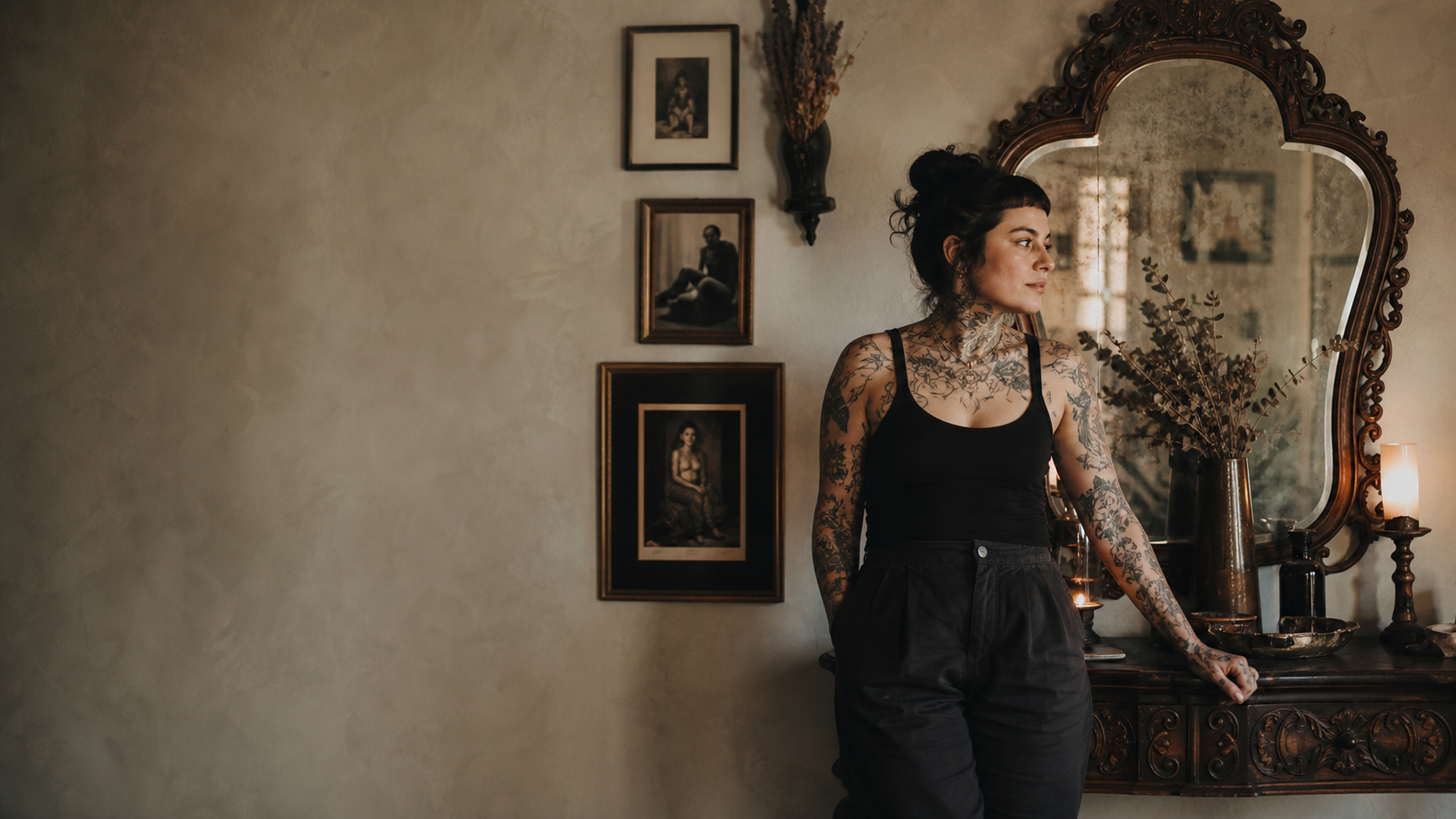 Tattooed artist in a luminous, art-filled Adorn studio