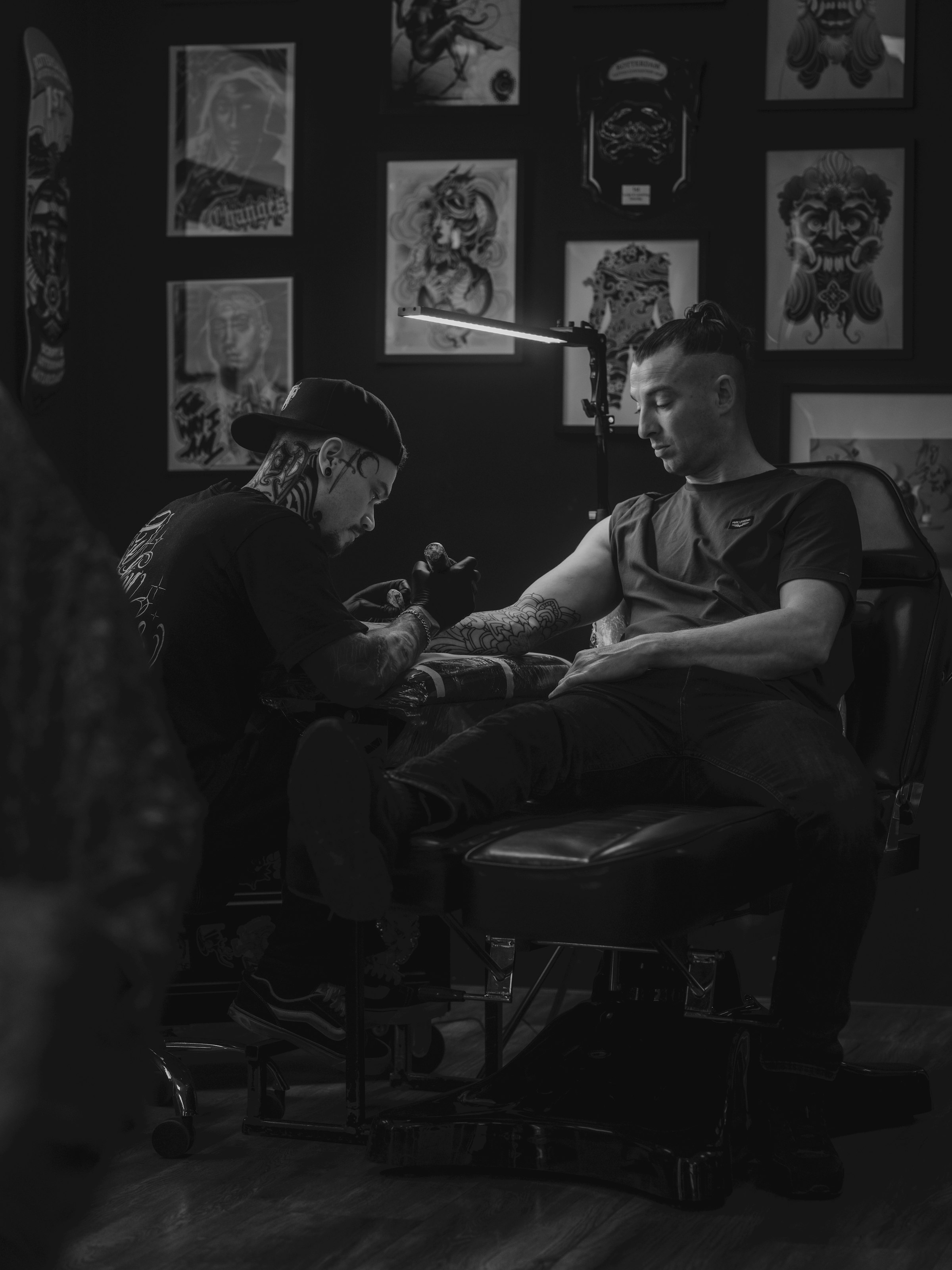 Tattoo artist at work in studio